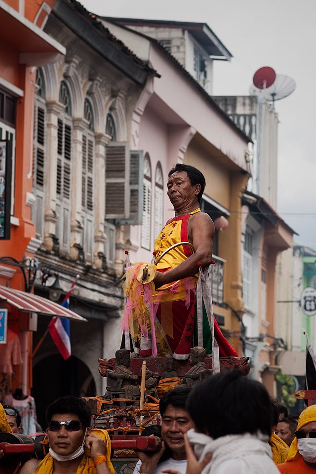 Medium God standing on palanquin.