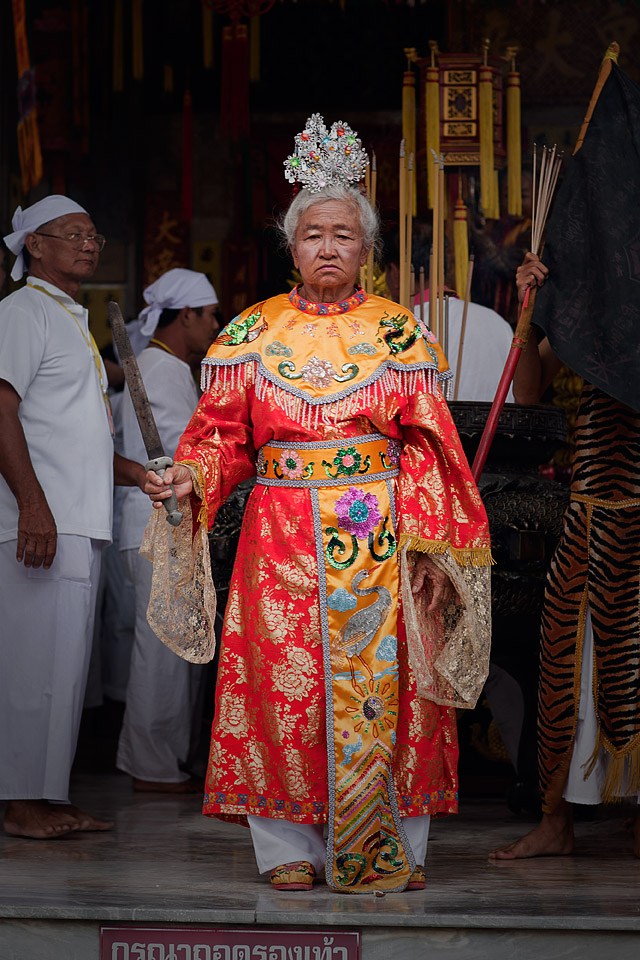 Elaborate costuming is worn at the Decorative shrine at the Burning incense at the Phuket Vegetarian Festival.