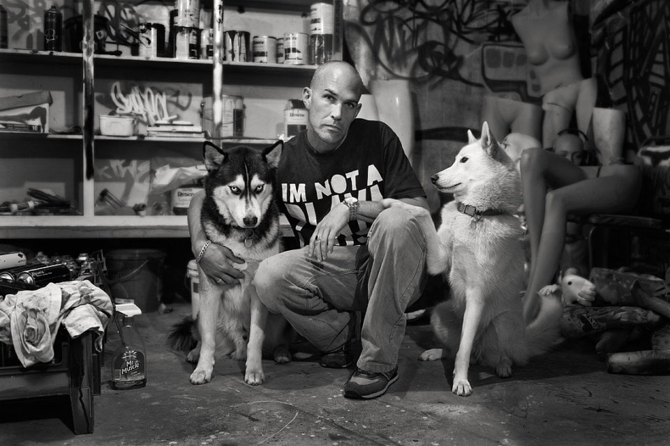 Phil ‘suspect’ Jones at Suspect studio with his dogs.