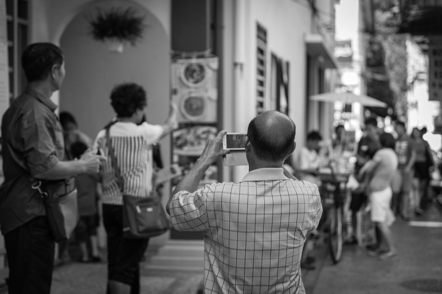 Tourists mobile phones Concubine Lane ipoh malaysia