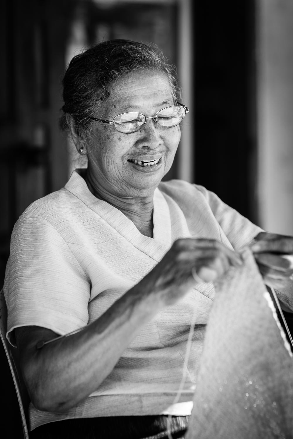luang prabang woman knitting monks jersey