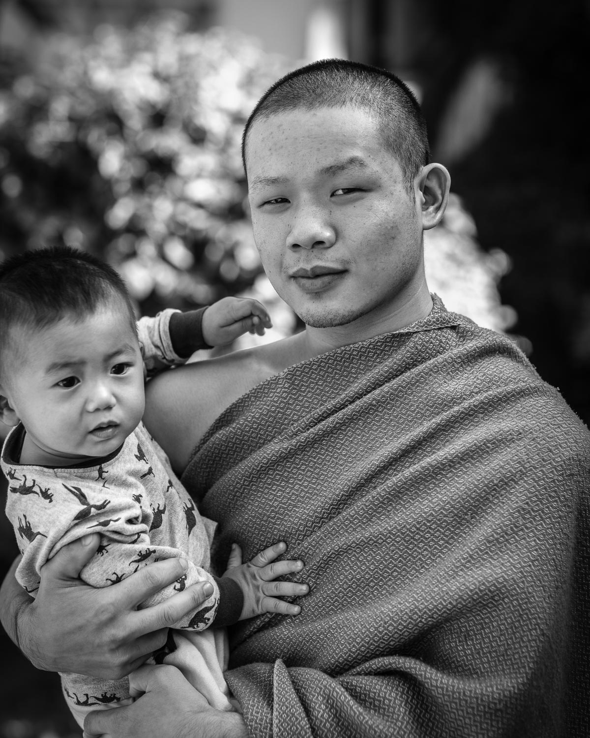 luang prabang monk holding baby