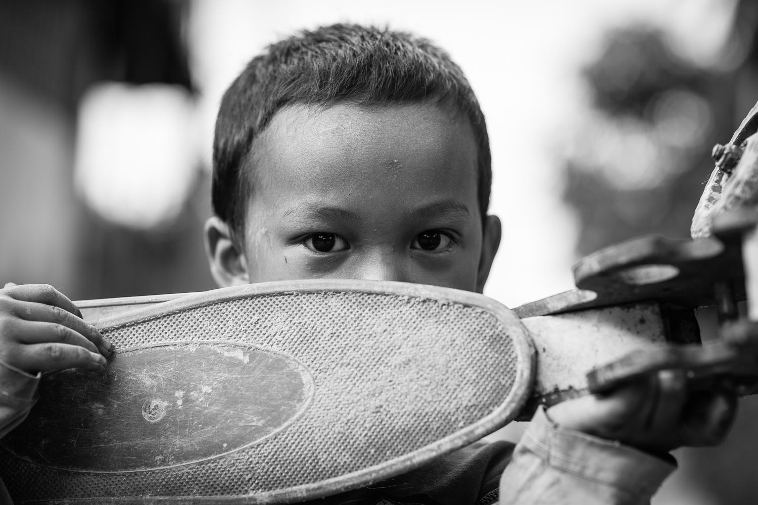 luang prabang boy holding skateboard