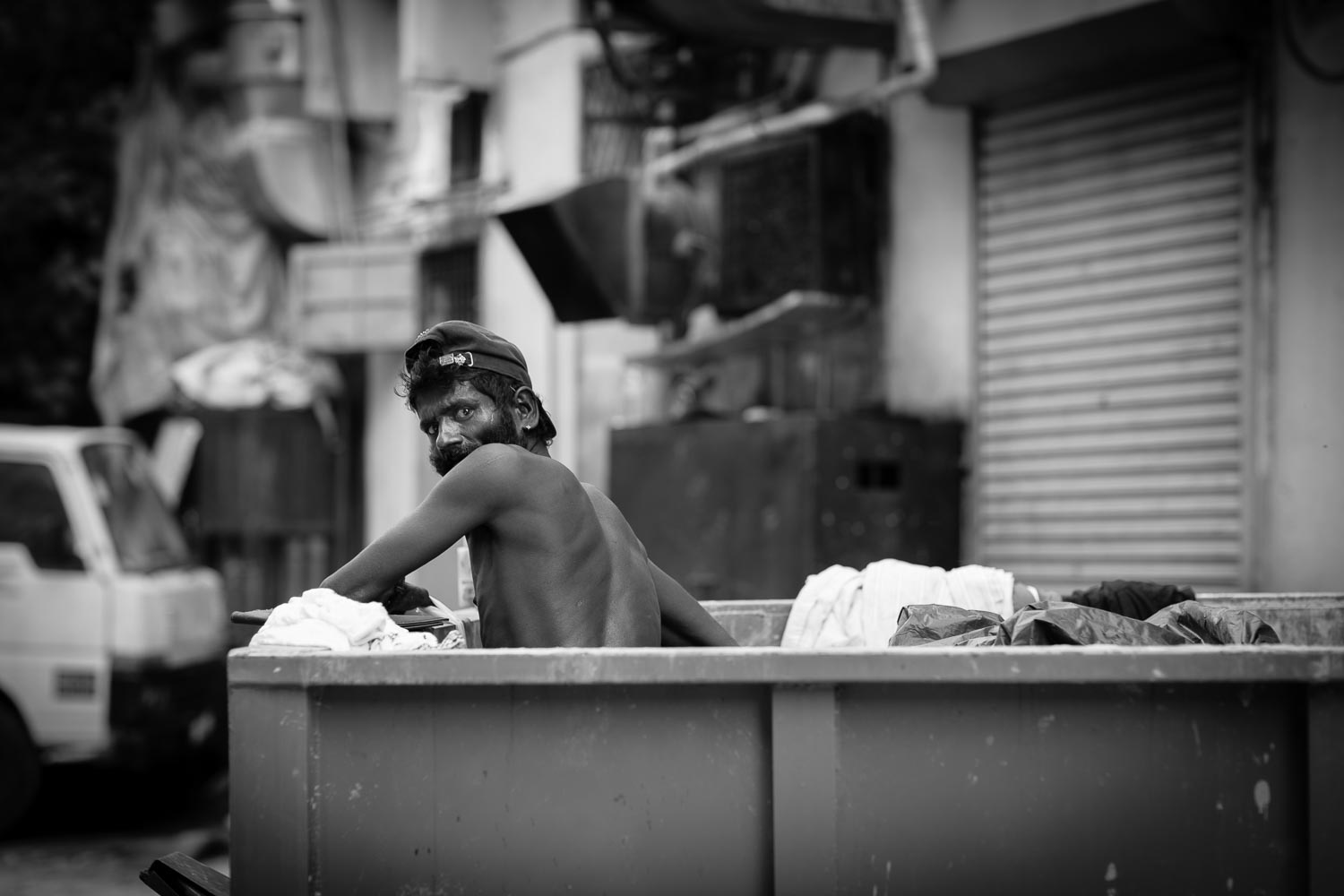 street portrait man rubbish skip collecting trash